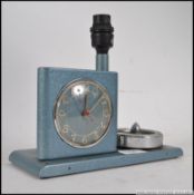 A vintage retro mid century bedside alarm clock lamp and ashtray combination,