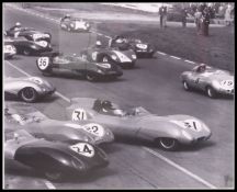 Motoring interest - A good pair of framed and glazed photographs featuring John Surtees and Lotus