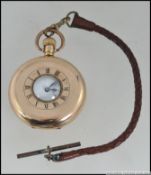 A early 20th century gold plated half hunter pocket watch by Denison,