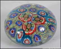 A glass Caithness style paperweight