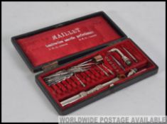 A vintage early 20th century French cased Dentists drill piece set.