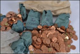 A large bag of uncirculated coins largely consisting of one penny coins 1967.
