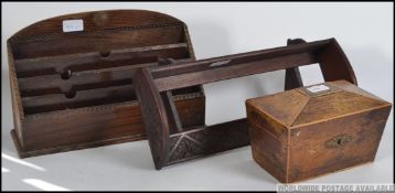A Victorian mahogany book trough of shaped form together with a sectional desk tidy and a