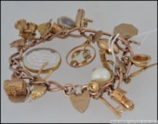 A hallmarked 9ct gold charm bracelet with approx 24 charms to include old woman who lives in a shoe,