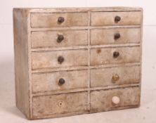 A vintage mid century Industrial 10 drawer filing cabinet with knob handles,