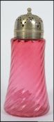 An early 20th century Cranberry glass sugar sifter having spiral glass tapering body with silver