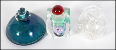 Two 20th century glass perfume bottles, along with an unusual small glass vase,