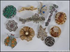 A good collection of vintage ladies costume jewellery brooches to include ladybird, tiger, filigree,