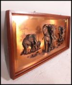A retro 1970's wall mounted copper repousse moulded elephant picture sculpture of rectangular form