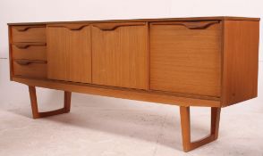 A retro 1970's teak wood Danish inspired sideboard having a straight three drawers flanked by a