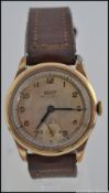 A vintage Tissot gentlemans early 20th century gold plated wristwatch set on leather strap.
