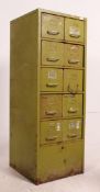 A mid century Industrial metal office filing stationary cabinet in the original green paint having