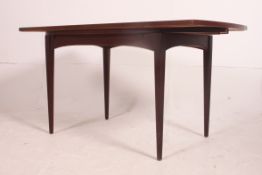 A vintage mid century Danish type teak dining table with unusual side sliding extending leaves to