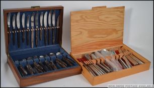 A good mid century Danish rosewood handled canteen of cutlery together with another cased canteen