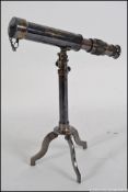 A brass cased telescope on matching stand .