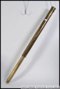 A large 19th century brass telescope of cylindrical form.