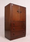 A 1930's oak Art Deco tallboy having drawers under linen cupboard above.