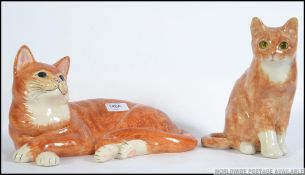 2 China cats , marmalade in colour ,