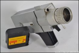 A retro vintage Super 8 cinecamera , Saimic KS 401 No. 3913 plus film.