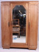 A 1930's Art Deco walnut breakfront triple wardrobe.