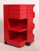 A retro 1970's Joe Columbo Boby trolley in red standing on castors and having t twist out drawers,