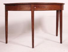 A 19th century oak demi lune console table raised on squared legs with half moon table top above.