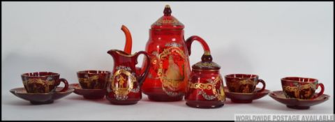 A 19th century Victorian Bohemian Figural Hand Painted Cranberry Glass Enamel eleven piece Tea