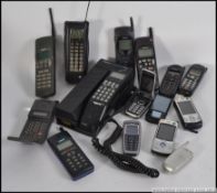 A collection of old mobile phones to include Nokia,