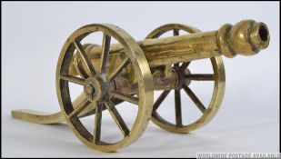 A 20th century heavy large cast brass desk cannon,
