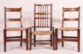 A 19th century north country elm windsor chair having carved legs with decorative spindle bobbin