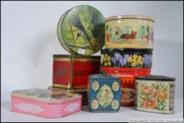A collection of vintage and retro advertising tins, to include Woodpecker, Squirrel,