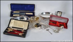 A good collection of vintage silver plate items to include cased flatware, ladles,