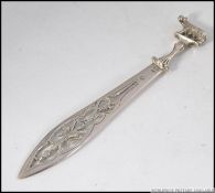 A silver 800 marked continental book mark having Romulus and remus adorned top with pierced blade.