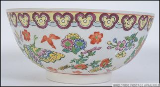 A 20th century Chinese bowl having Butterfly and Peony design with character marks to base.