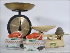 A set of vintage Salter kitchen scales along with a vintage set of Harper balance scales along with