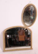 A late 19th early 20th century wooden painted framed over mantle mirror along with an oval wall