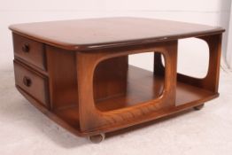 An Ercol Pandora golden dawn elm coffee table, with under shelf fitted with two drawers.