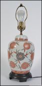 A Japanese ceramic chrysanthemum ginger jar converted into a lamp.
