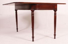 A Georgian 19th century mahogany tea table / games table having flip over table top supported with