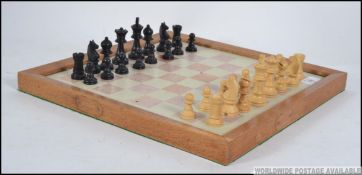 A vintage boxed wooden chess set by L&K of London together with a marble / stone chess board