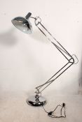 A large contemporary retro styled floorstanding chrome anglepoise standard lamp with terraced base