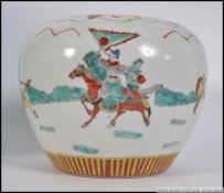 A 19th / 20th century Japanese / Chinese squat vase adorned with warriors and a geometric pattern