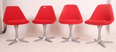 A set of 4 1970's Maurice Burke for Arkana red vinyl and polished chrome swivel dining chairs