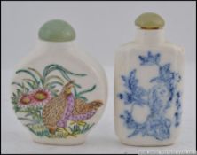 A pair of Chinese scent / snuff bottles one with Quails and the other with scholars,