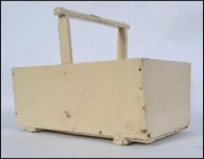 A vintage original mid century painted wooden gardeners vegetable trug having central handle with