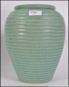 A large 1960's ovoid vase being of baluster ribbed for and turquoise glazed,