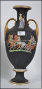 A Victorian terracotta twin handled amphora vase having black ground and transfer printed with