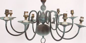 A 20th century vintage brass chandelier having multiple arms with central ball finials,