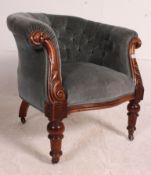 A good Victorian mahogany show wood chesterfield armchair raised on turned legs with ceramic