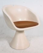 A retro 1970's Maurice Burke for Arkana swivel egg chairs having the original orange upholstered